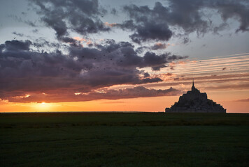 Fototapeta premium Beautiful sunset with clouds at Mont saint-Michel