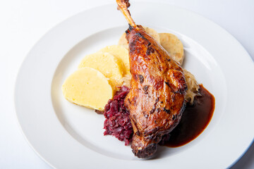 Grilled goose/duck leg with dumplings and cabbage