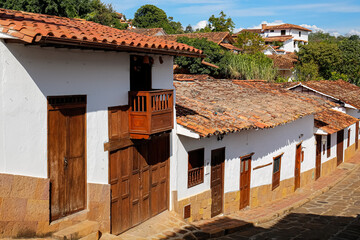 View to typical traditional houses in historic town Barichara on a sunny day, Colombia