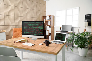 Workplace of programmer in modern office