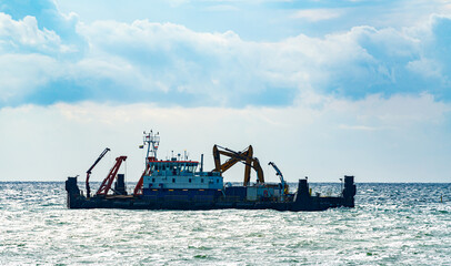 Seagoing dredging barge working on a new port facility for the Fehmarn Belt tunnel connection...