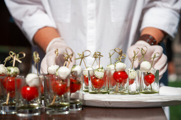 Food catering concept: Various snacks on table, outdoor banquet