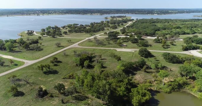 Aerial flight over camping spots and Promontory Park on Lake Proctor in Comanche County in Texas.