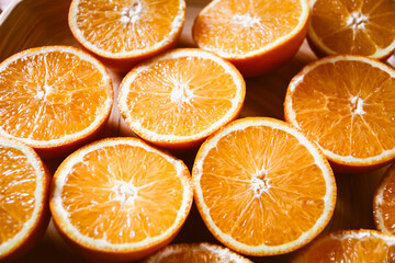 Bunch of fresh sliced oranges on a tray