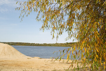 river,small ripples on the water,slow current,yellow sand Bank.