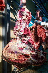 Fototapeta na wymiar Butchering pork carcasses at a meat processing plant