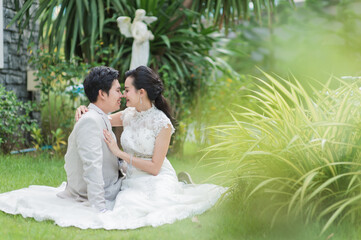 Asian man and woman couples Smiling and happy hugging.