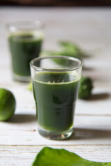 A glass of fresh home made vegetable juice with use of selective focus.