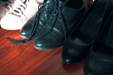 men's and women's shoes black and white