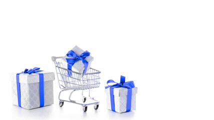 Xmas sale. Trolley cart for supermarket with christmas or birthday gift box isolated on white background. Online valentine, xmas shopping concept.