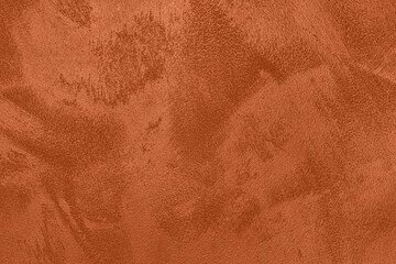 Saturated dark orange brown colored low contrast Concrete textured background with roughness and irregularities. 2021, 2022 color trend.