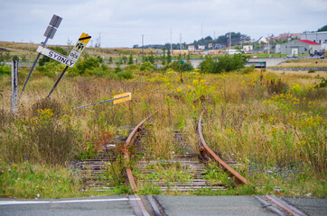 Picturesque street view with railroad tracks, flowers and parks in romantic fisher town in Sydney,...