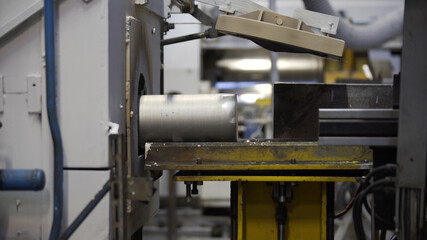 Aluminium extrusion production line factory. Production of Complex lightweight extruded aluminium metal profiles, commonly used as material in construction and manufacturing