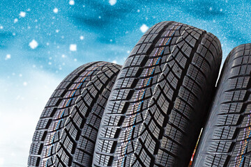 winter tyre cover on Lights on blue and snow background