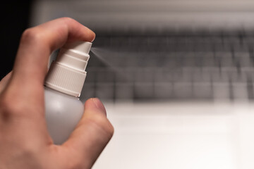 Covid19 disinfection of the business workplace with laptop working from home