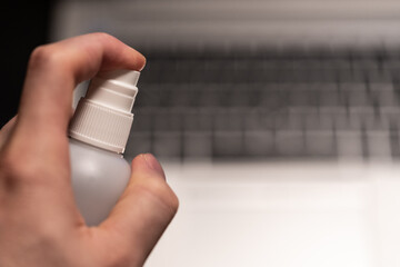 Covid19 disinfection of the business workplace with laptop working from home