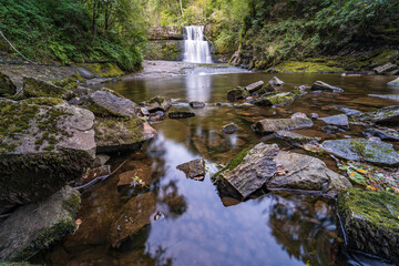Sgwd Clun-Gwyn Waterfall in Waterfall Country in Brecon Beacons National Park and Fforest Fawr Geopark, the Vale of Neath. South Wales, the United Kingdom