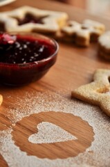 cookies with black currant jam on a table