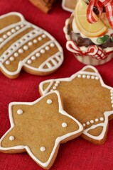 gingerbread glove and gingerbread stars on the red background
