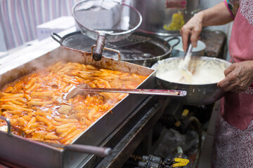 Korean street food fried vegetables and Stir fried Rice Cake.