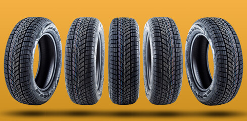 Car tires isolated on yellow background