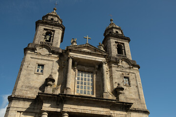 Fototapeta na wymiar front view of San Francisco convent in Santiago de Compostela, baroque and neo classic architecture example with clear blue sky