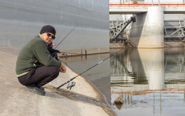 man on the hunt, fishing, fishing rod on the water
