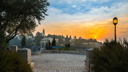 Beautiful sunrise over Mount Zion: Dormition Abbey, Jerusalem university college and greek...