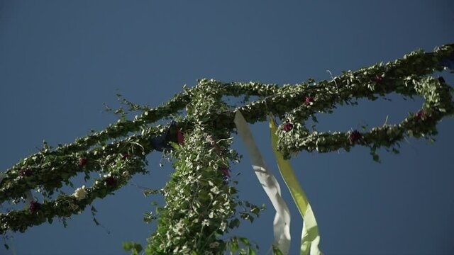 Swedish midsummer pole slow motion video shot on sunny summer day