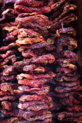 dried tomatoes hanging in clustersappetizer, background, closeup, clusters, cooking, dehydrator, detail, dry, dry-ed, food, green, handmade, hanging, healthy, heap, homemade, ingredient, isolated, ita