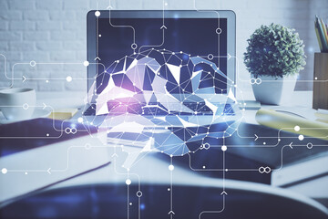 Double exposure of work space with computer and human brain drawing hologram. Brainstorm concept.