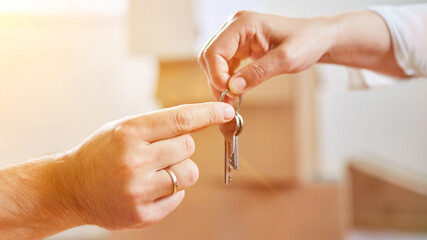 Hands hand over keys when changing tenants or buying a house