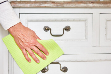 Clean your hand with a cloth at the dresser