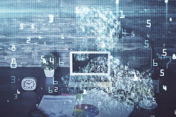 Double exposure of laptop computer and technology theme hologram. Concept of freelance work.