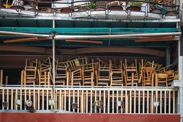 Chairs and Stools Stacked  in an Empty Closed Restaurant