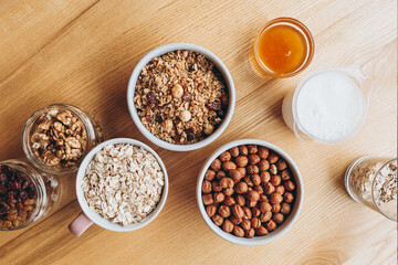 a delicious and crunchy oatmeal granola with honey, nuts, dried fruits and grains. Dynamic healthy food photography