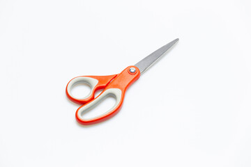 Red scissors isolated on white background