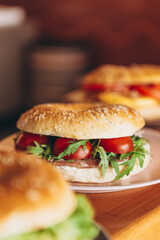 delicious and appetizing breakfast: a bagel stuffed on a plate