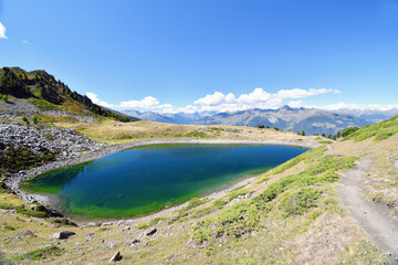 Fototapeta na wymiar Lake Chamolé, a small alpine lake above Pila in the Aosta valley