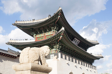 Fototapeta premium Gyeongbokgung palace landmark of Seoul, South Korea. roof with sky and cloud.