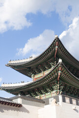 Fototapeta na wymiar Gyeongbokgung palace landmark of Seoul, South Korea. roof with sky and cloud.