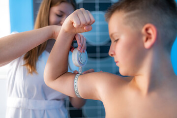 Muscle strength and volume analysis in children, anthropometric upper arm circumference tape measurement