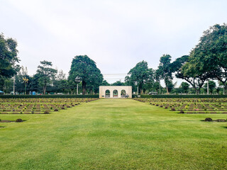 Fototapeta na wymiar Kanchanaburi War Cemetery,is the main prisoner of war cemetery for victims of Japanese imprisonment while building the Burma Railway,located in Kanchanaburi,Thailand