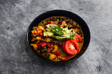 plant-based food, vegan poke bowl with mexican beans capsicums tomatoes and avocado