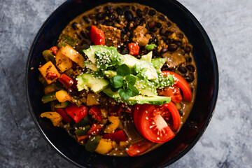 plant-based food, vegan poke bowl with mexican beans capsicums tomatoes and avocado