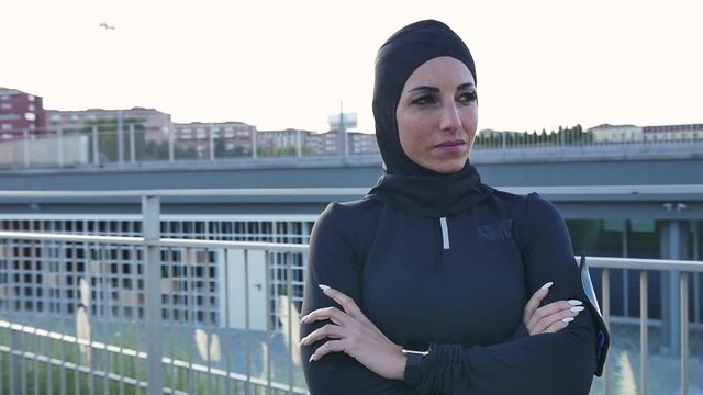 Beautiful muslim woman running in the morning. Image of a runner wearing burkini