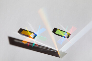 Glass geometric figures prisms with light diffraction of spectrum colors and complex reflection...