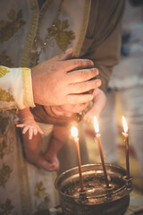 Obraz na płótnie Canvas Orthodox Christian rite of baptism of a child. Baptism of the Child. Christianity. Bathing a child. Orthodox cross. Orthodox Church.