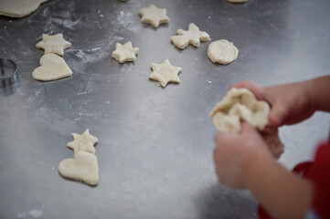 Kids playing with dough making homemade pastry products