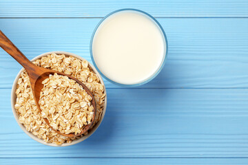 Non dairy oat milk and oat flakes in bowl